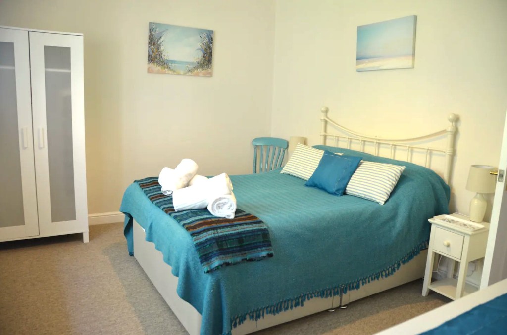 Bedroom 1 - an ensuite bedroom in The Little Red House Mumbles Wales holiday cottage.