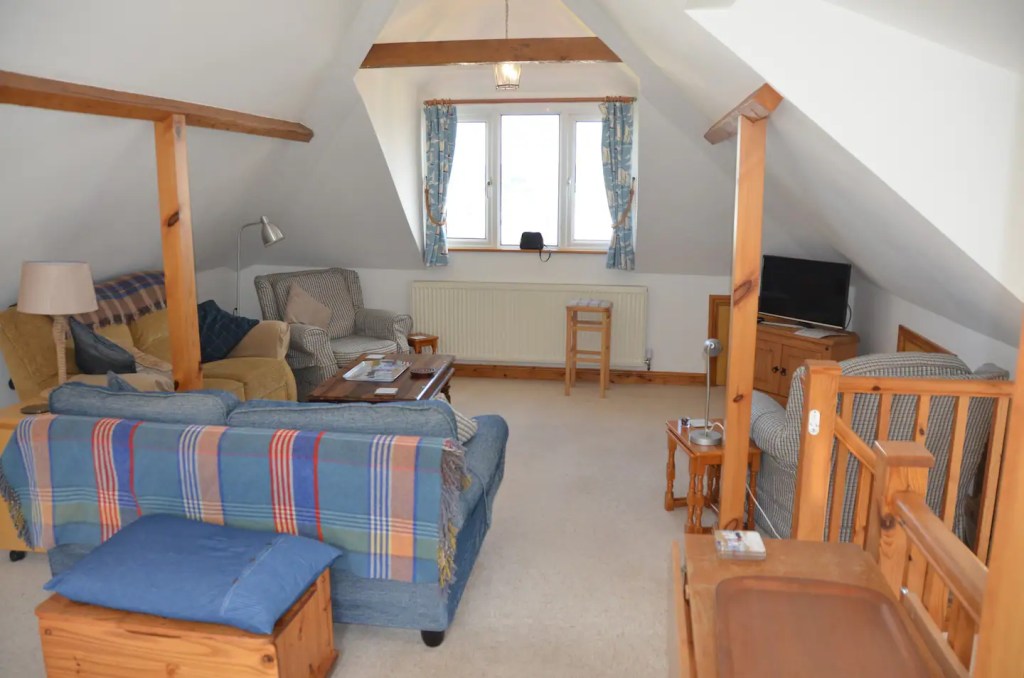 The Little Red House Mumbles Wales 4* holiday cottage.
First floor sitting room. TV with Netflix,
books, games, maps, hobby table.