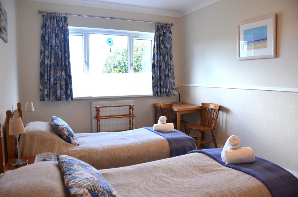 Bedroom 3 with twin beds at The Little Red House Mumbles holiday cottage.